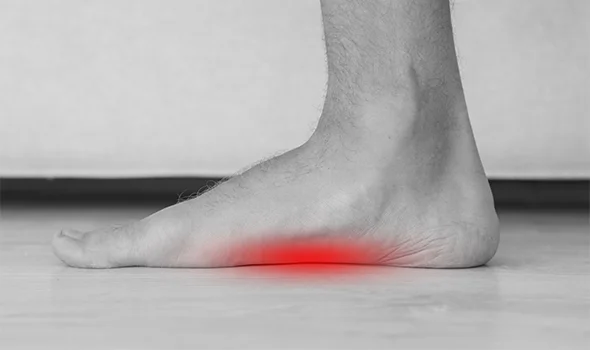 What is the cause of foot pain when walking